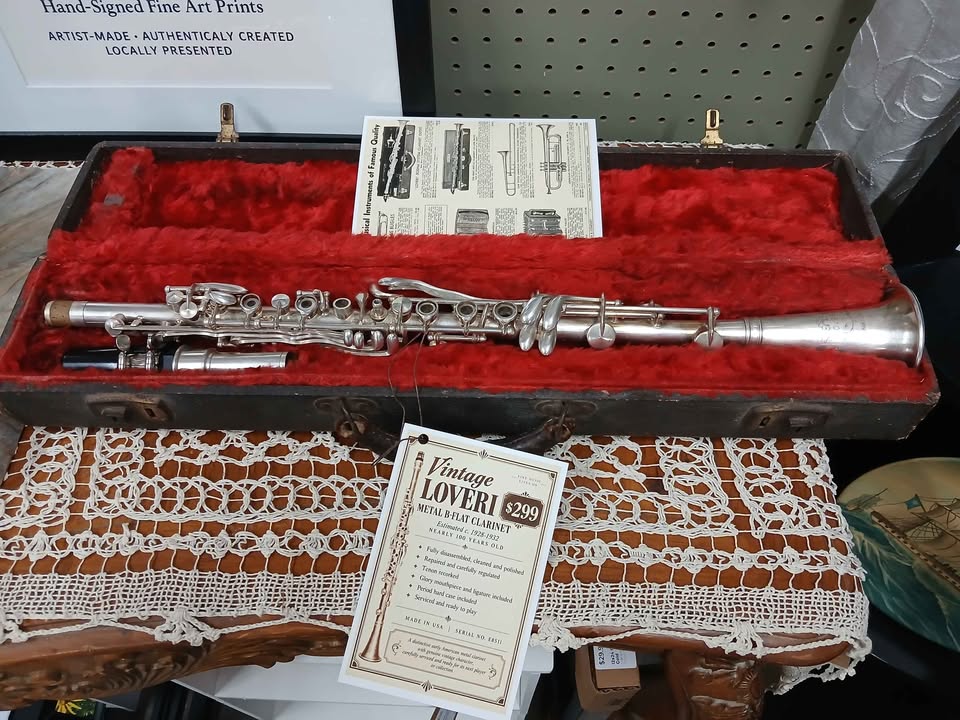 Kelly's restored Loveri metal B-flat clarinet displayed in its red-lined period case